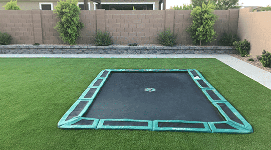 In-ground trampoline flush to backyard and seamless design